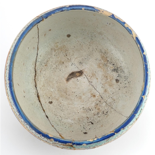 138 - Islamic pottery footed bowl hand painted with calligraphy and flowers, 28cm in diameter