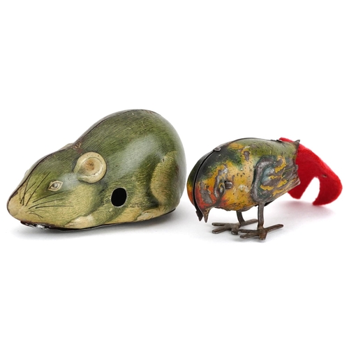 1365 - Two vintage tinplate clockwork animals comprising a mouse and bird, the largest 8.5cm in length