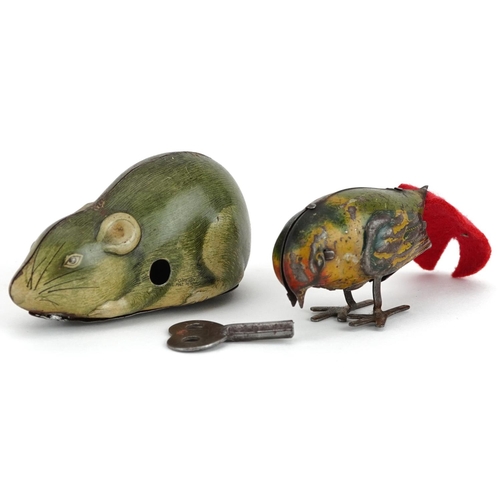 1365 - Two vintage tinplate clockwork animals comprising a mouse and bird, the largest 8.5cm in length