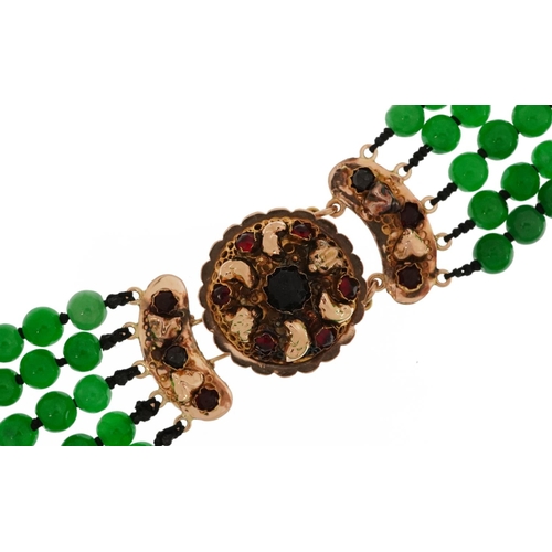 2104 - Chinese green jade five row bead necklace with 18ct gold clasp set with garnets, 62cm in length, 163... 