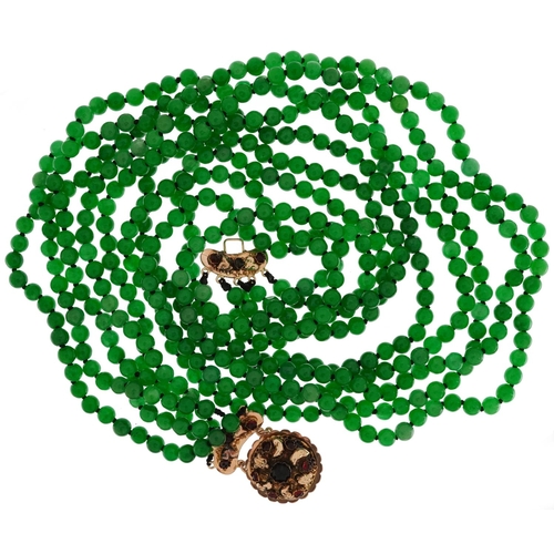 2104 - Chinese green jade five row bead necklace with 18ct gold clasp set with garnets, 62cm in length, 163... 