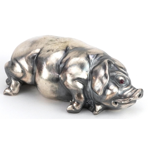 268 - Silver recumbent pig with cabochon ruby eyes, impressed Russian marks to the base, 7cm in length, 41... 