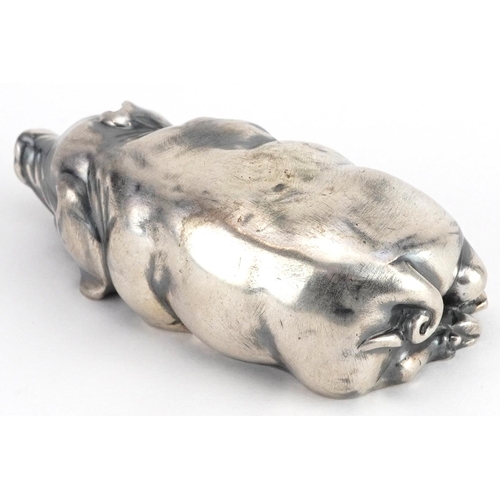 268 - Silver recumbent pig with cabochon ruby eyes, impressed Russian marks to the base, 7cm in length, 41... 