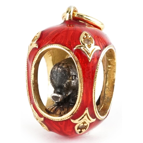 2610 - Silver gilt and guilloche enamel elephant egg pendant set with clear stones, 2.2cm high, 8.3g