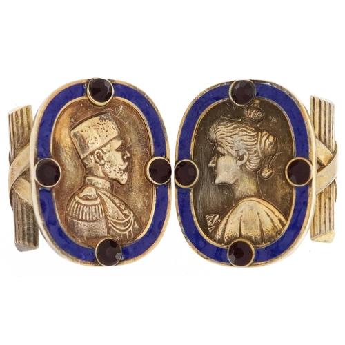 2137 - Pair of silver gilt and enamel portrait cufflinks, each set with red stones, impressed Russian marks... 