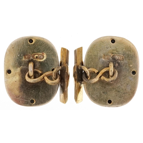 2137 - Pair of silver gilt and enamel portrait cufflinks, each set with red stones, impressed Russian marks... 