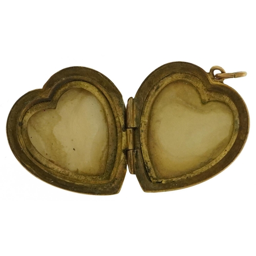 2171 - 9ct gold back and front engine turned love heart locket, 2.1cm high, 3.8g