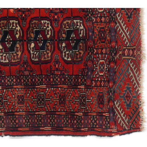 1085 - Rectangular Bukhara red and blue ground rug having an allover geometric design, 116cm x 88cm