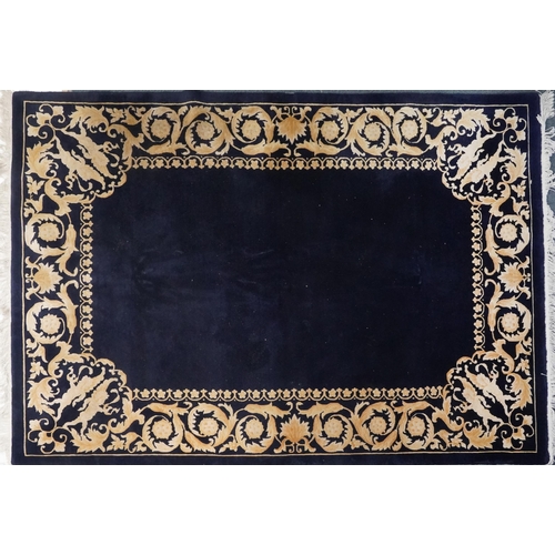 1047 - Large rectangular blue ground rug having a cream and gold floral and Putti design border, 

250cm x ... 