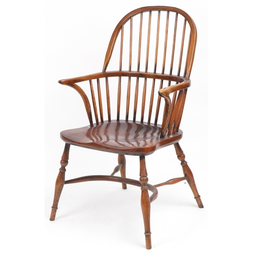 1005 - Antique elm Windsor chair with crinoline stretcher, 99cm high