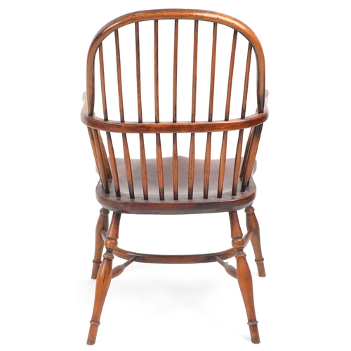 1005 - Antique elm Windsor chair with crinoline stretcher, 99cm high