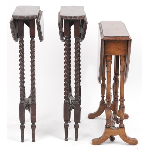 1082 - Three drop leaf tables including a pair of oak barley twist examples, the largest 65cm high