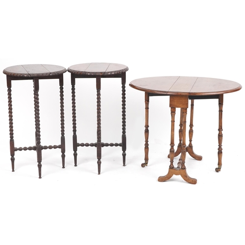 1082 - Three drop leaf tables including a pair of oak barley twist examples, the largest 65cm high