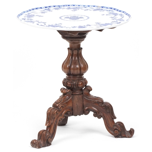 1038 - Victorian carved mahogany and walnut tripod table with porcelain tray top, 60cm high x 56cm in diame... 