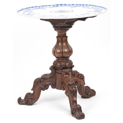 1038 - Victorian carved mahogany and walnut tripod table with porcelain tray top, 60cm high x 56cm in diame... 