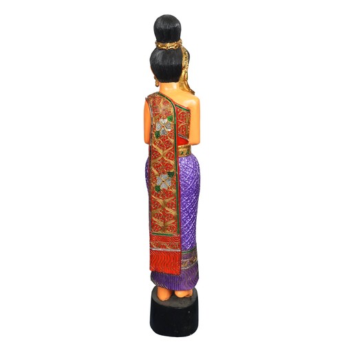 1016 - Thai floor standing carved wood figure of a female wearing a jewelled dress, 128cm high