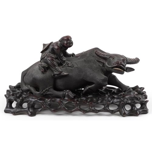 308 - Large Chinese hardwood carving on stand of a boy on buffalo, 41.5cm in length