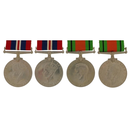 423 - Four British military World War II medals with two boxes of issue