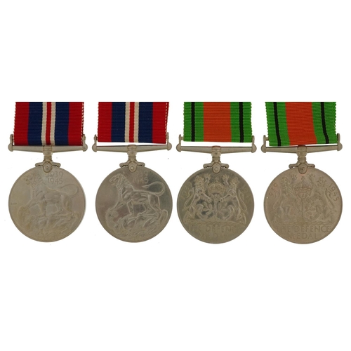 423 - Four British military World War II medals with two boxes of issue