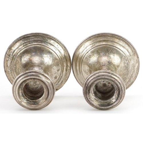 1167 - Gorham, pair of American sterling silver circular dwarf candlesticks, 8.5cm high, 468.5g