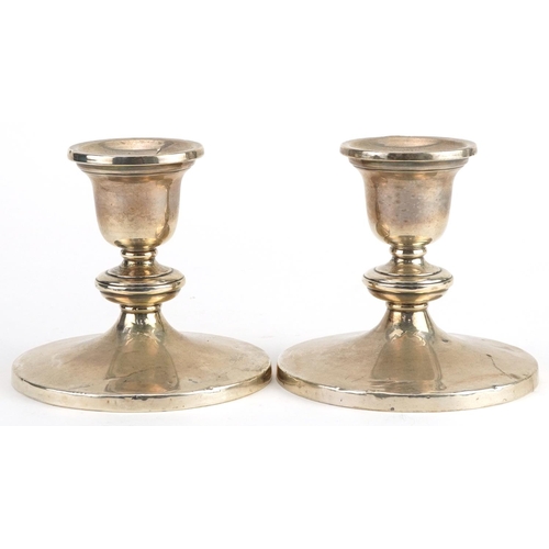 189 - Pair of sterling silver circular dwarf candlesticks, 9cm high, 488.8g