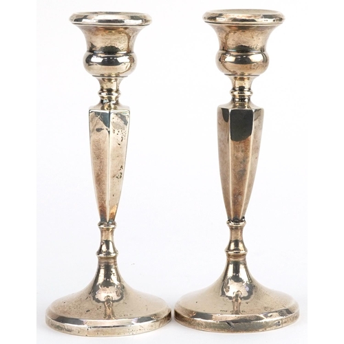 168 - Pair of Edwardian hexagonal tapering candlesticks, indistinct maker's mark Birmingham 1921, 16cm hig... 