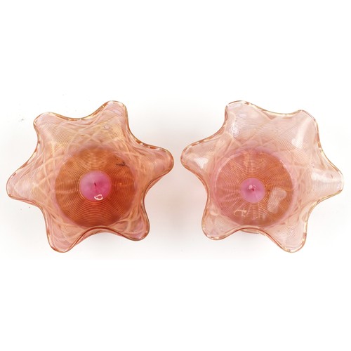 1153 - Pair of Stuart and Son's gilt and peach glass finger bowls, each 14cm in diameter