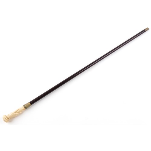 1313 - Hardwood walking stick with carved bone hand design pommel, 90cm in length