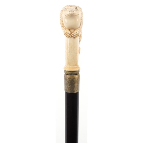 1312 - Hardwood walking stick with carved bone toad design pommel, 90cm in length