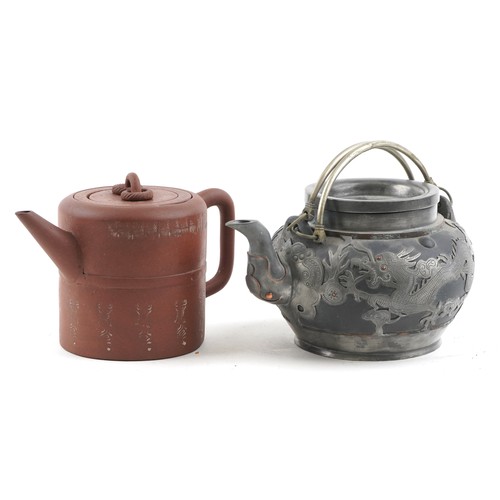 1245 - Two Chinese teapots including Yixing terracotta example with liner, the largest 18cm in length