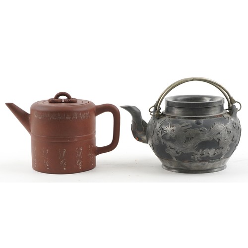 1245 - Two Chinese teapots including Yixing terracotta example with liner, the largest 18cm in length