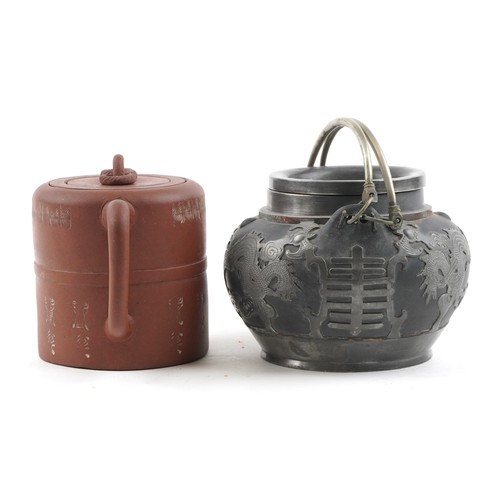 1245 - Two Chinese teapots including Yixing terracotta example with liner, the largest 18cm in length