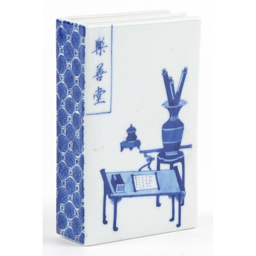 306 - Chinese blue and white porcelain scroll weight in the form of a book hand painted with a scholar's d... 