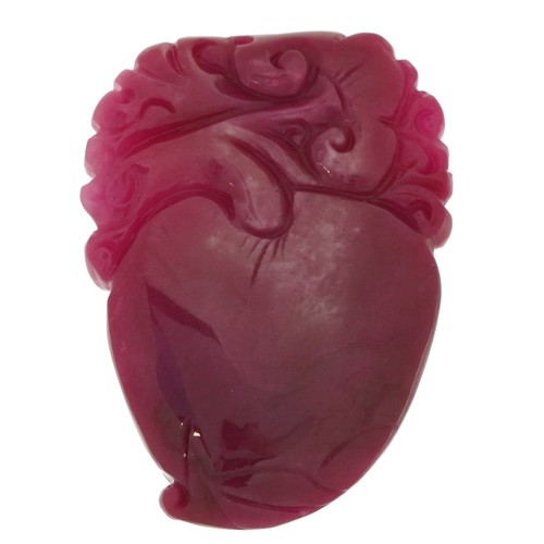 26 - Chinese pink tourmaline pendant carved with a dragon and fruit, 6.5cm high