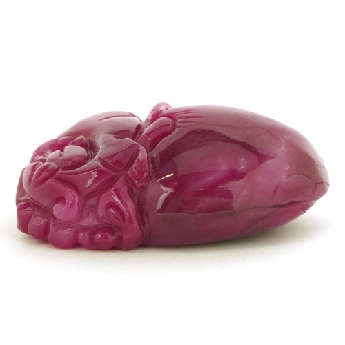 26 - Chinese pink tourmaline pendant carved with a dragon and fruit, 6.5cm high