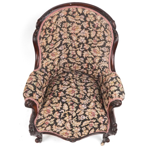 1012 - Victorian mahogany arm chair with floral upholstery and serpentine front, 90cm high