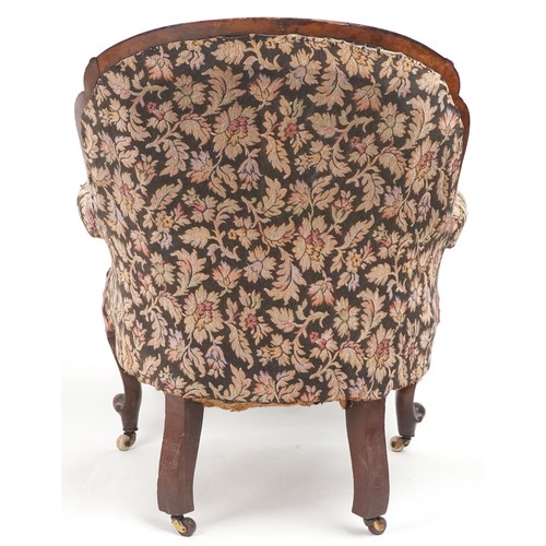 1012 - Victorian mahogany arm chair with floral upholstery and serpentine front, 90cm high