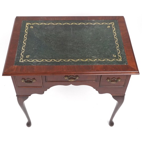 1060 - Mahogany writing desk with tooled green leather insert, three draws and cabriole legs, 74cm H x 77cm... 