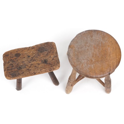 1057 - Two antique wooden stools, the largest 31cm high