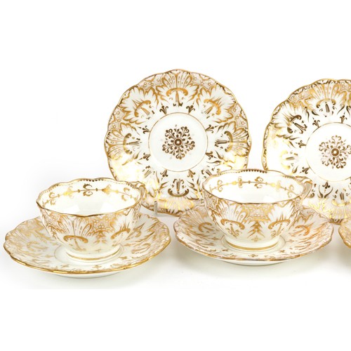 1219 - Victorian teaware gilded with flowers including four cups with saucers, the largest each 14cm in dia... 