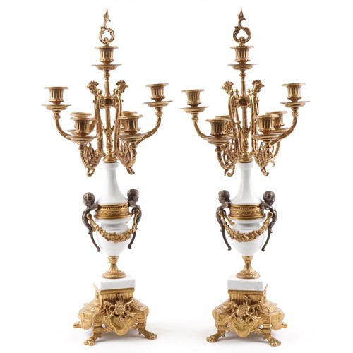 311 - Pair of French style brass and white marble seven branch candelabras, each 69.5cm high