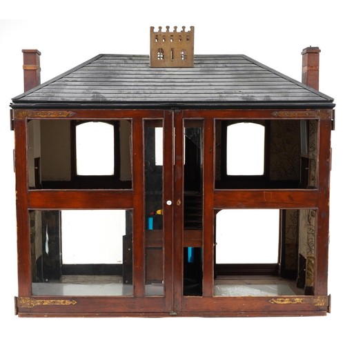 1357 - Large antique scratch built wooden doll's house with various glass panels and brass carrying handles... 