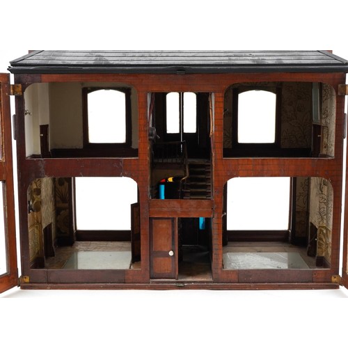 1357 - Large antique scratch built wooden doll's house with various glass panels and brass carrying handles... 