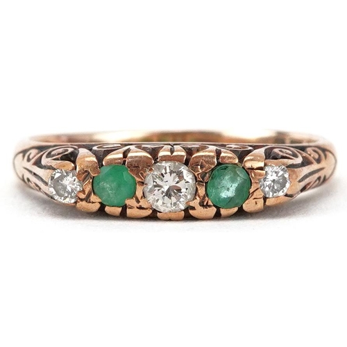 2249 - 9ct gold diamond and emerald graduated five stone ring with scrolled shoulders, the largest diamond ... 