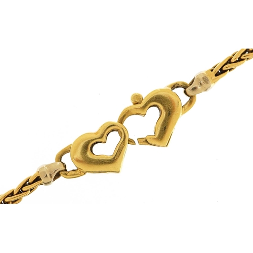 2127 - 18ct gold bracelet with double love heart clasp, 20cm in length, 11.1g