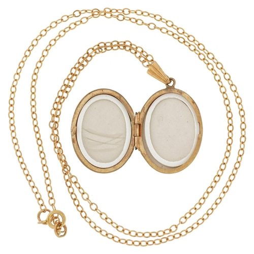 2208 - 9ct gold oval locket with engine turned decoration on 9ct gold Belcher link necklace, 3.1cm high and... 