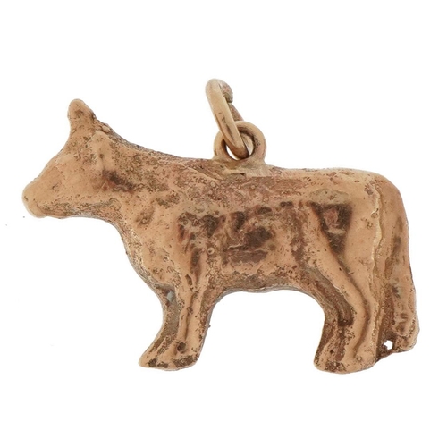 2191 - Unmarked gold charm in the form of a bull, tests as 9ct gold, 2.3cm wide, 8.0g