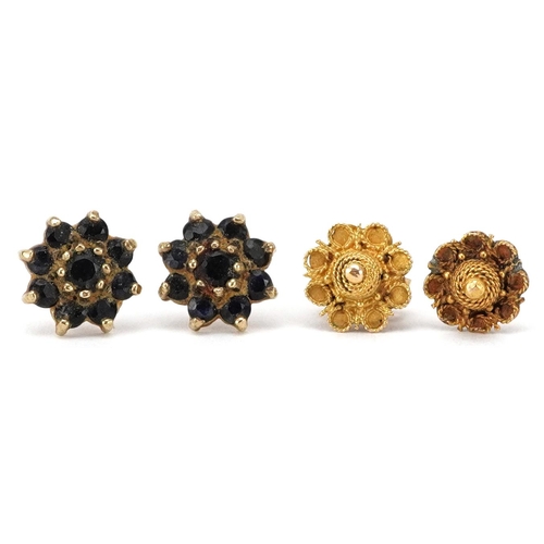 2693 - Pair of unmarked gold sapphire flower head stud earrings and a pair of filigree stud examples, the l... 