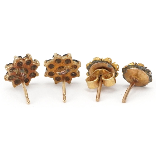 2693 - Pair of unmarked gold sapphire flower head stud earrings and a pair of filigree stud examples, the l... 