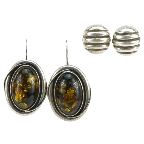 2678 - Two pairs of silver earrings including a pair of natural amber style cabochons, the largest 4.0cm hi... 